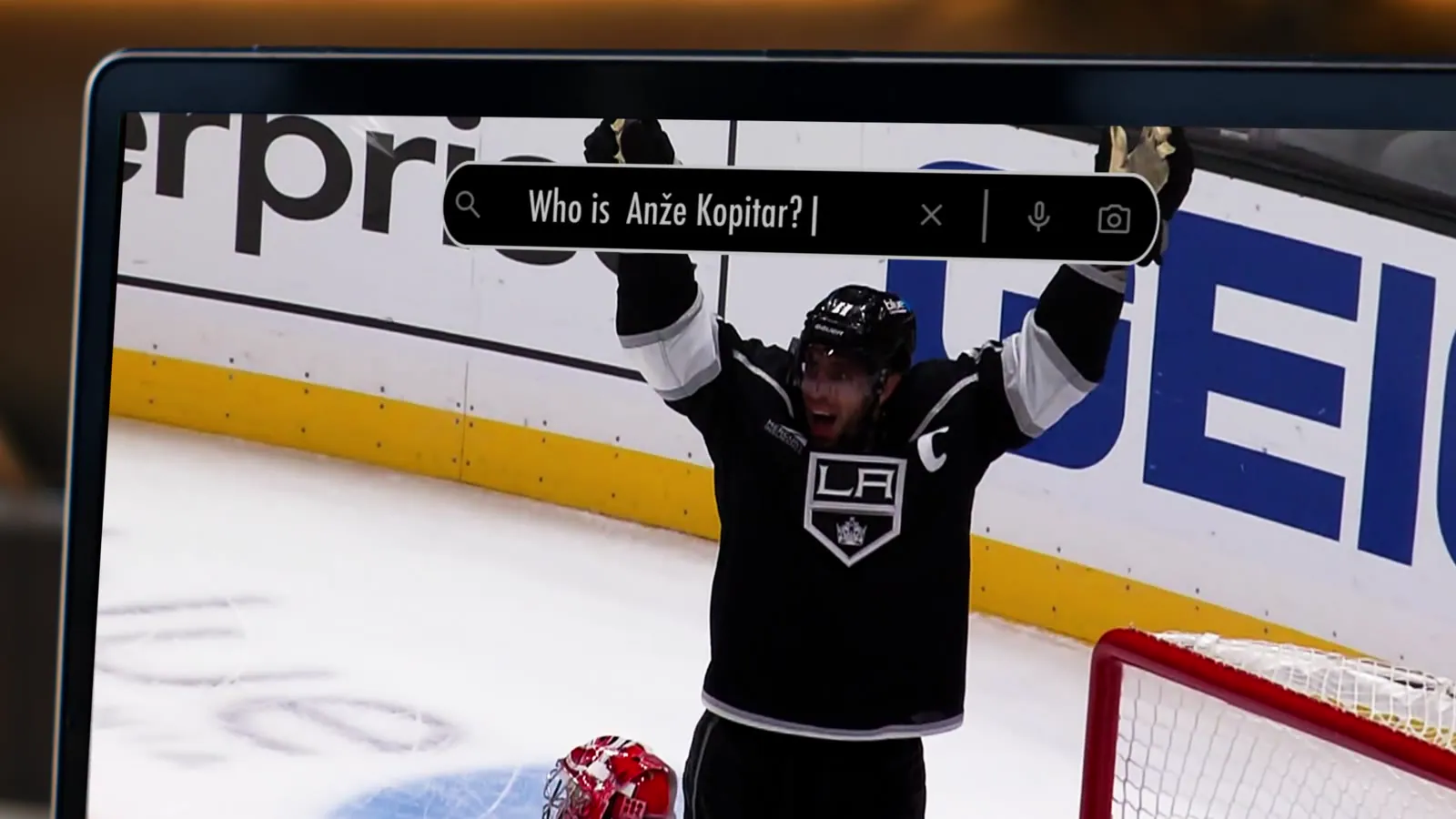 Who Is Anže Kopitar? A search bar reads 'Who is Anže' over game footage